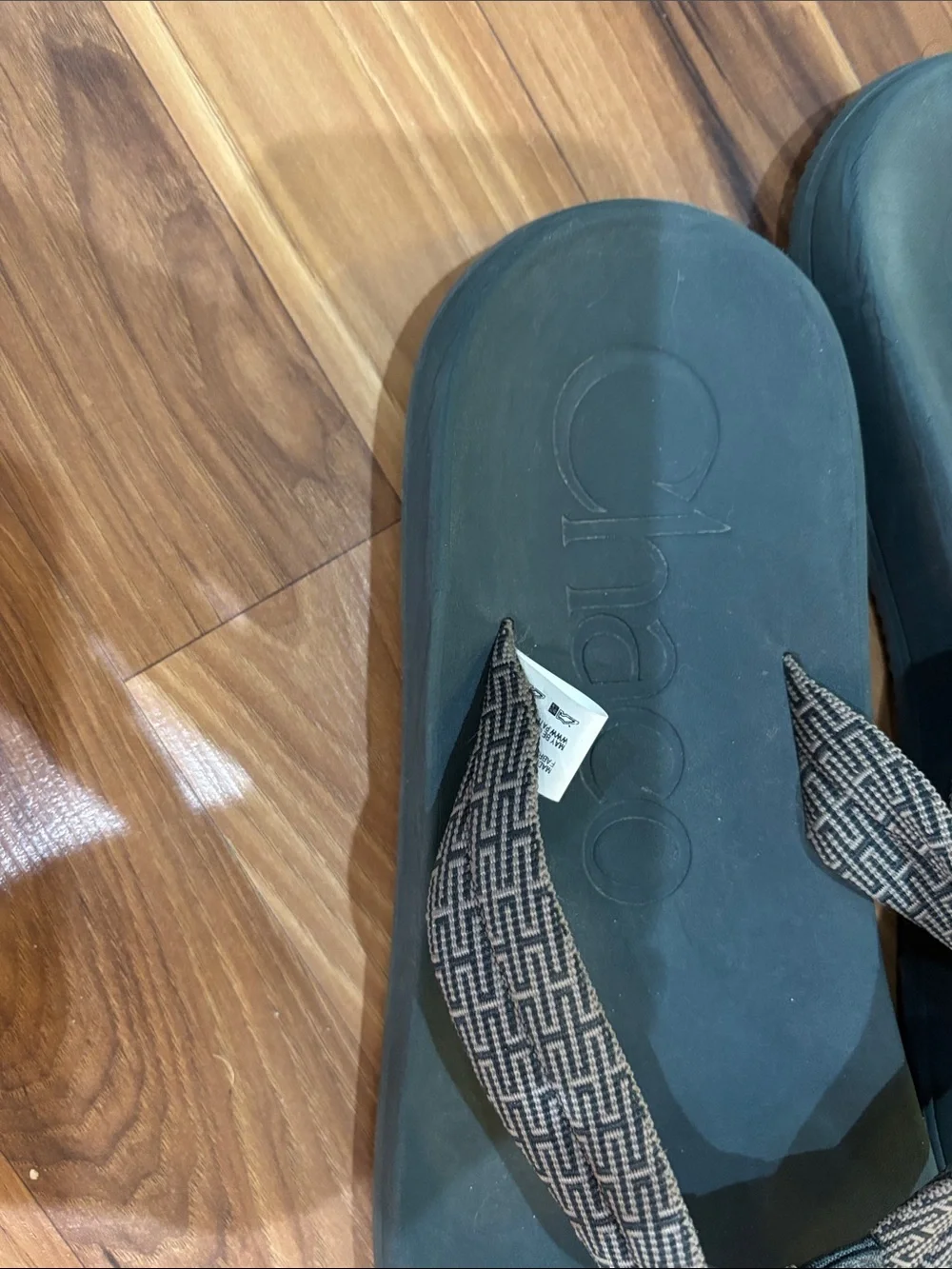 Chaco Men's Black Footbed with Brown Patterned Strap Flip Sandals